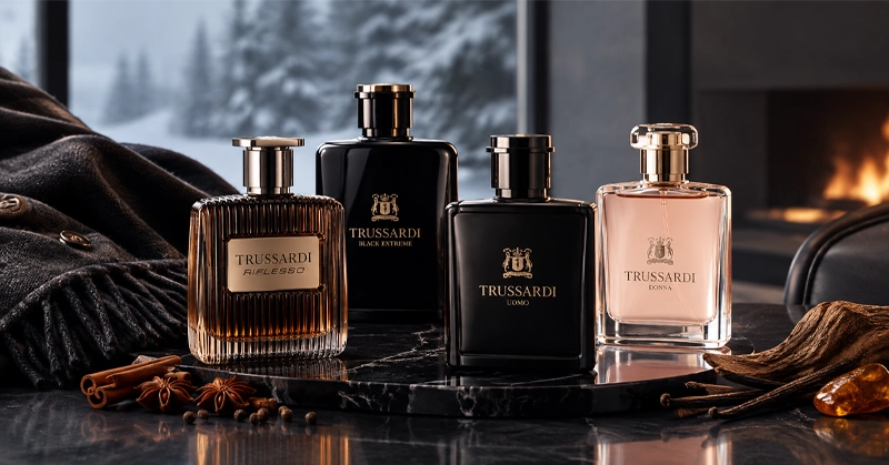 4 تا از بهترین عطرهای تروساردی زمستانه روی میز با پس زمینه پنجره و هوای برفی سرد